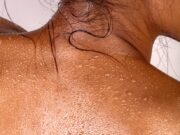 the back of a woman's head with white spots on it