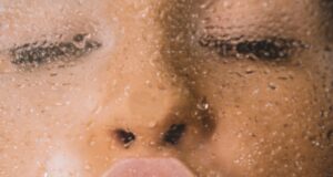 woman in water with water droplets