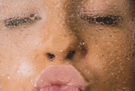 woman in water with water droplets