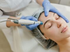 a woman getting a facial peel from a doctor