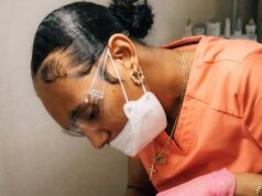 a man getting his teeth checked by a dentist