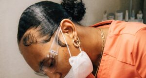 a man getting his teeth checked by a dentist