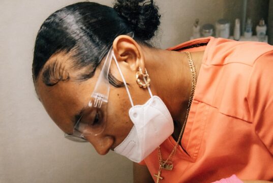a man getting his teeth checked by a dentist